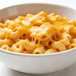 creamy mac and cheese cooked in an Instant Pot with elbow pasta