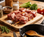 raw pork belly slices on wooden board