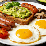 A hearty breakfast plate with scrambled eggs, sausage, and toast.